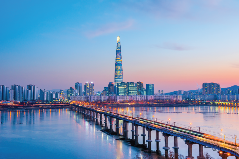 view of seoul skyline over han river sunset