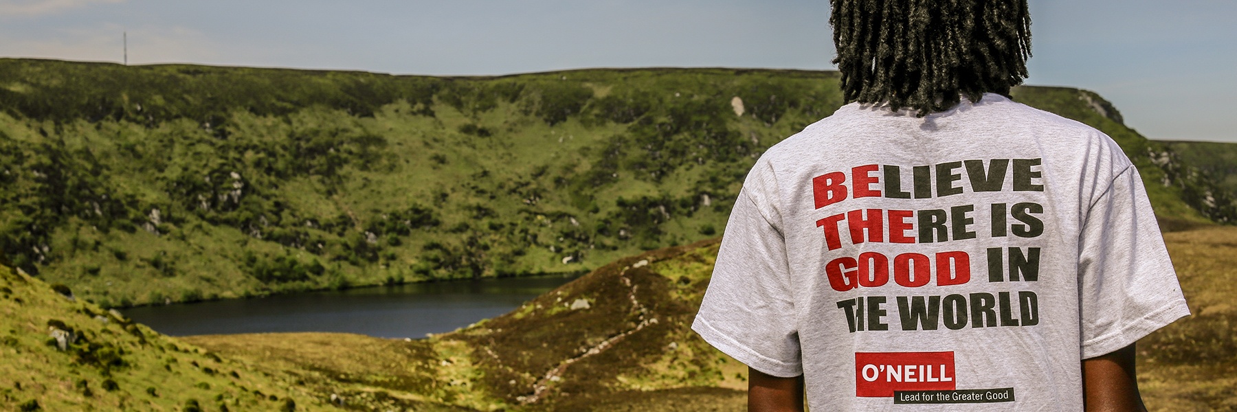 Student overlooks the Wicklow Mountains in Ireland. Text reads: With O'Neill International the World is Your Classroom.